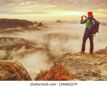 Hiker Blogger Taking Photo By Smartphone Of Fall Sunset Mountains Landscape. Sharing Travel Lifestyle And Adventure Vacations. Use Outdoor Modern Technology