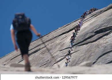 Hiker Climbing On A Rock, Half Dome, Yosemite Valley, Yosemite National Park, California, USA