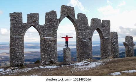 Hiker At The Fyrish Monument Near Alness In The Scottish Highlights, United Kingdom.