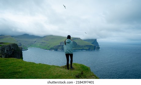 Hiker Girl Walking On Hike With Fjord View. Living Healthy Active Lifestyle. Concept For Trail Hiking. Adventure Travel In Wildlife Nature