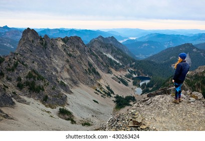 A Hiker Looking Towards Mountains and Alpine Lake. 
Kaleetan Peak Trail, Snoqualmie Pass, Washington
