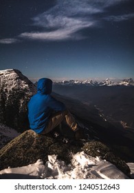 A Hiker Observing Mt Robson, The Highest Mountain Of The Canadian Rockies, During A Winter Starry Night. Blue Jacket, Adventure, Dark Sky Preserve Festival. Whistlers Mountain, Jasper, Alberta Canada.