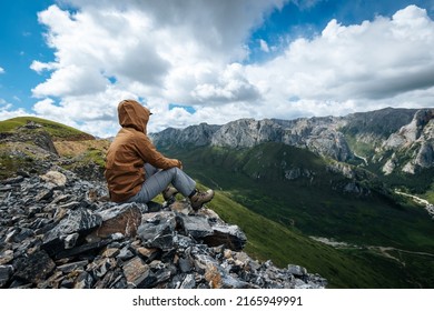 Hiker On High Altitude Mountain Top Enjoy The View