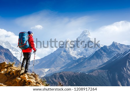 Hiker on the top in Himalayas mountains. Travel sport lifestyle concept