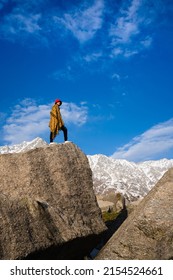 Hiker on top of the mountain in Triund Trek, Himachal Pradesh, India. 
