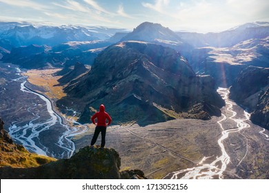 Hiker Overlooking Glacier River from Thorsmork in Southern Iceland