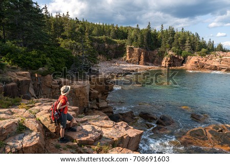 hiker taking in the views in Acadia National Park
