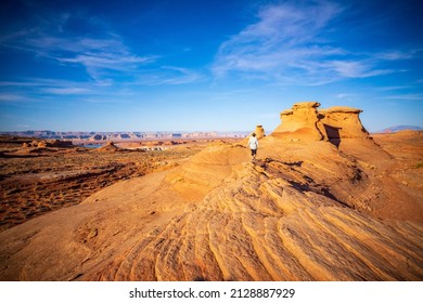 Hiker At Wave Sandstone Trail Near Lake Powell