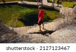 Hiker at Jacob’s Well in Wimberley, TX