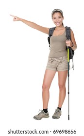 Hiker Woman Standing Isolated. Female Hiker Pointing. Young Woman Wearing Backpacking Bag And Hiking Poles. Isolated On White Background In Full Length.