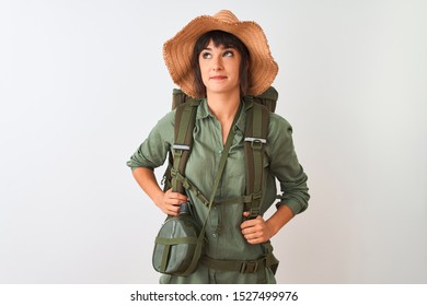 Hiker Woman Wearing Backpack Hat And Water Canteen Over Isolated White Background Smiling Looking To The Side And Staring Away Thinking.