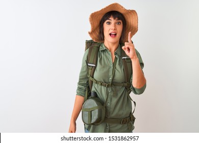 Hiker Woman Wearing Backpack Hat And Water Canteen Over Isolated White Background Pointing Finger Up With Successful Idea. Exited And Happy. Number One.