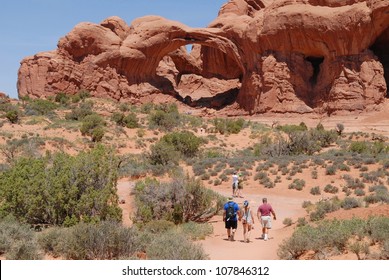 Hikers At Arches National Park In Utah, USA