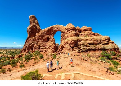 Hikers At Arches National Park In Utah, USA 