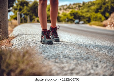 Hikers boots on a empty mountain road