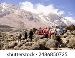 Hikers climbing mountain Kilimanjaro along the machame route