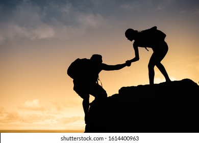 Hikers Helping Each Other Climbing Mountain Stock Photo 1614400963 ...