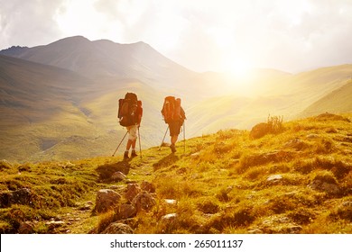 hikers on the trail in the Caucasian mountains. Trek to Kazbek mount - Powered by Shutterstock