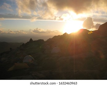 Hikers' Tents Set Up On A Mountain Top In The Snowy Mountains, Australia Before Sunset 