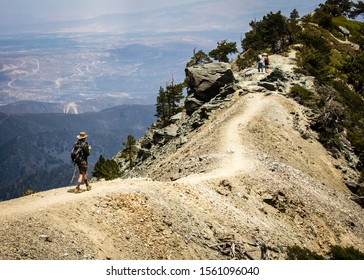 Hikers Traverse Devil's Backbone Trail - Medium Shot