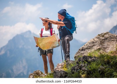 Hikers Using Map To Navigate Outdoor