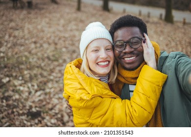 Hiking - Active Young Couple In Love. Couple Taking Self-portrait Picture On Hike. Happy Romantic Interracial Couple. Cute Young Couple Of Millennial Or Generation Z Adventurers Or Travellers