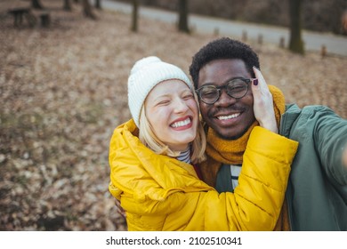 Hiking - Active Young Couple In Love. Couple Taking Self-portrait Picture On Hike. Happy Romantic Interracial Couple. Cute Young Couple Of Millennial Or Generation Z Adventurers Or Travellers