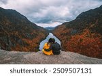 Hiking Adventure Couple Hold Each Other On Top of Mountain Autumn Fall Foliage Indian Head Adirondacks at Sunset. Relationship Love Travel Landscape