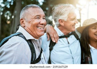 . Hiking, Adventure And Exploring With A Carefree And Excited Male Hiker With His Senior Friends Outdoors. Enjoying A Hike Or Walk In The Forest Or Woods As A Group Of Retired People For Leisure.