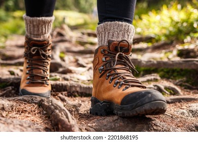 Hiking boot. Legs on mountain trail during trekking in forest. Leather ankle shoes - Shutterstock ID 2201868195