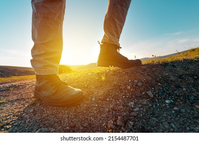 Hiking Boot On Rocky Mountain Terrain, Man Walking Outdoor In Nature, Selective Focus