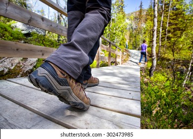 Hiking Boots Close-up. Tourist Walking On The Trail. Norway
