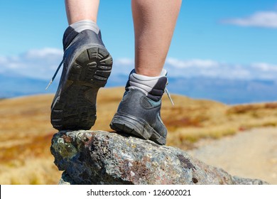 Hiking Boots On The Rock In The Mountains