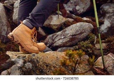 Hiking Boots On The Rock In The Mountains.