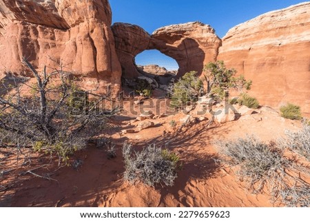 hiking the broken arch trail in arches national park in utah, usa