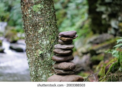 Hiking Cairn By A Forest Stream