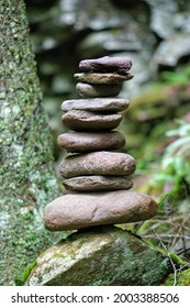 Hiking Cairn By A Forest Stream