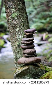 Hiking Cairn By A Forest Stream