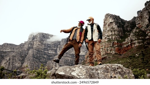 Hiking, cliff and mature men on mountain with backpack for adventure, trekking and fitness. Travel, nature and happy people outdoors for wellness, journey or exercise on holiday, walking or vacation - Powered by Shutterstock