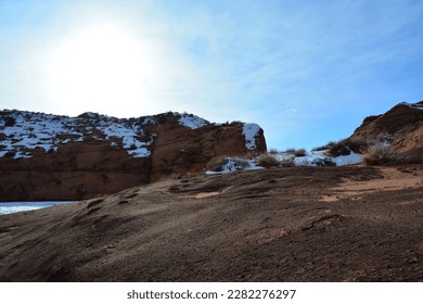 hiking the Dry Fork Slot Canyon with snow at the Lower trailhead at a sunny day in December, Hole in the Rock road in Utah Grand Staircase Escalante National Monument, United States of America USA - Shutterstock ID 2282276297