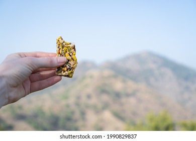 Hiking Food. Hiking Muesli Bar With Nuts. Snack Bar. Oat And Nut Bar In The Mountains. Sweet Healthy And Hearty Food.