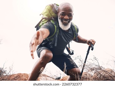 Hiking, help and portrait of senior man reaching hand during hike, fitness and cardio in nature on light background. Helping, hands and face of elderly guy offering support while trekking in a forest - Powered by Shutterstock