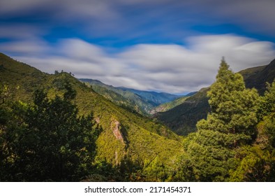 Hiking Levada trail 25 Fontes in Laurel forest - Path to the famous Twenty-Five Fountains in beautiful landscape scenery - Madeira Island, Portugal. October 2021. Long exposure picture. - Shutterstock ID 2171454371