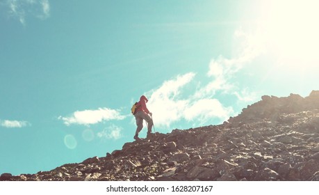 Hiking man in Canadian mountains. Hike is the popular recreation activity in North America. There are a lot of picturesque trails. - Shutterstock ID 1628207167