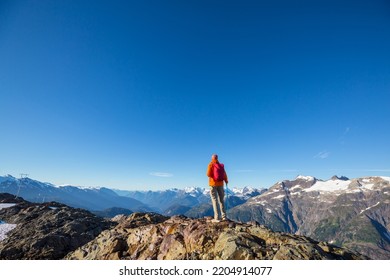 Hiking Man In Canadian Mountains. Hike Is The Popular Recreation Activity In North America. There Are A Lot Of Picturesque Trails.