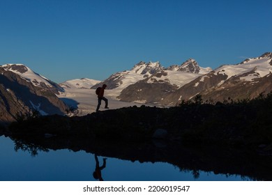 Hiking Man In Canadian Mountains. Hike Is The Popular Recreation Activity In North America. There Are A Lot Of Picturesque Trails.