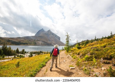 Hiking Man In Canadian Mountains. Hike Is The Popular Recreation Activity In North America. There Are A Lot Of Picturesque Trails.