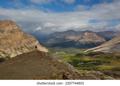 Hiking Man In Canadian Mountains. Hike Is The Popular Recreation Activity In North America. There Are A Lot Of Picturesque Trails.