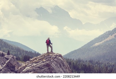 Hiking Man In Canadian Mountains. Hike Is The Popular Recreation Activity In North America. There Are A Lot Of Picturesque Trails.