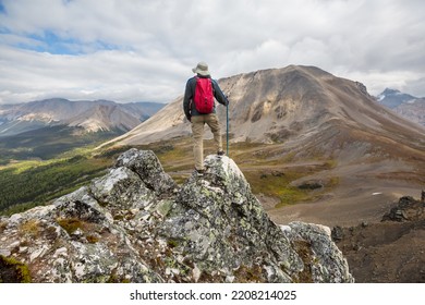 Hiking Man In Canadian Mountains. Hike Is The Popular Recreation Activity In North America. There Are A Lot Of Picturesque Trails.